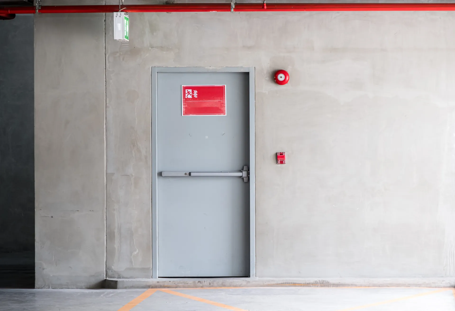 Glazed fire door within a modern commercial corridor